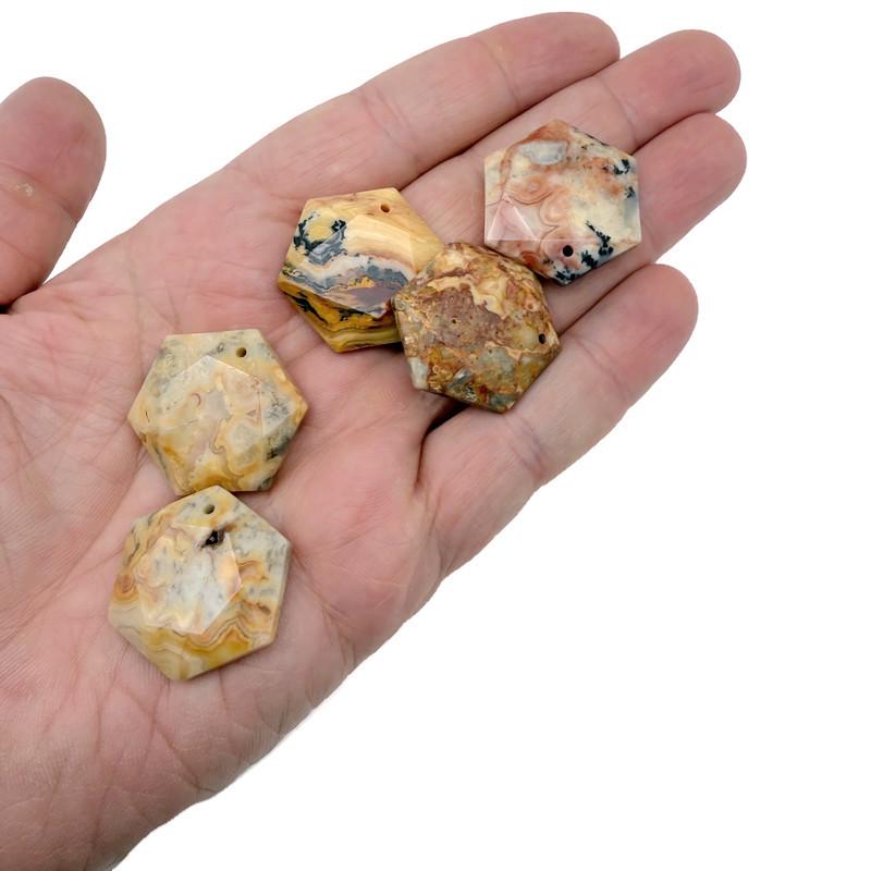 Faceted Crazy Lace Agate hexagon crystal pendant necklace with gemstone bead, showcasing vibrant, intricate stone details.