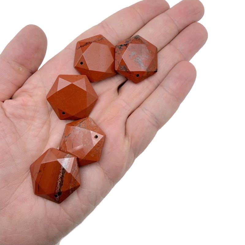 Red Jasper hexagon crystal pendant necklace with faceted stone bead from GemstoneGO, showcasing a polished, geometric gemstone pendant.