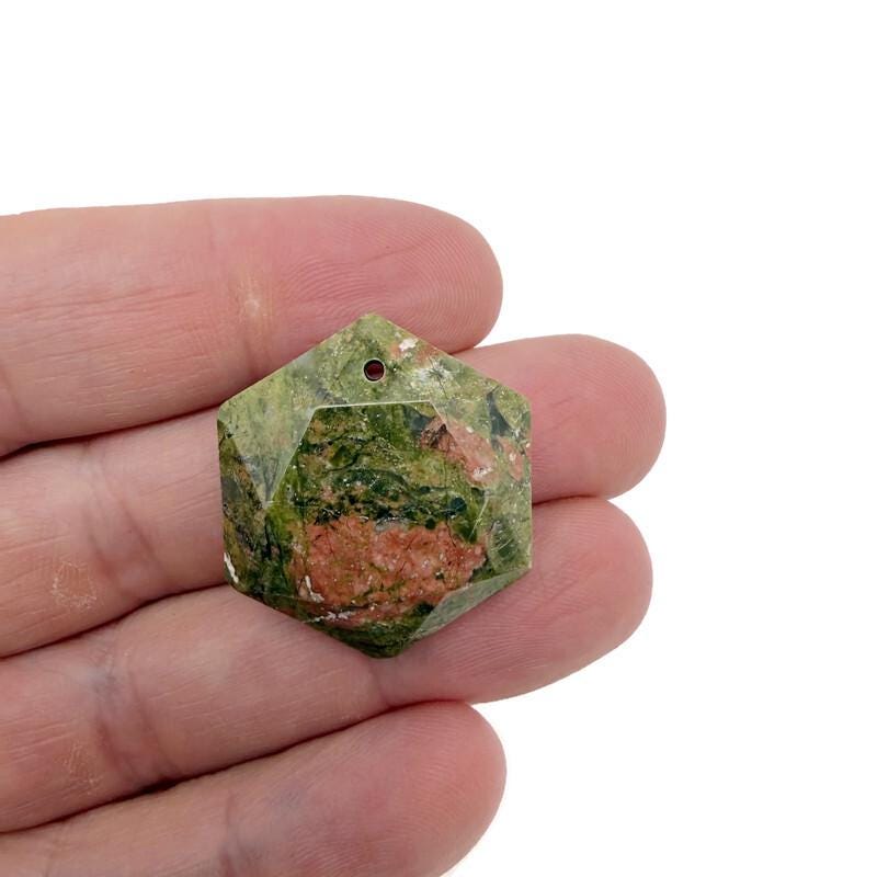 Faceted unakite hexagon crystal pendant necklace with gemstone bead from GemstoneGO, showcasing a polished green and pink stone.