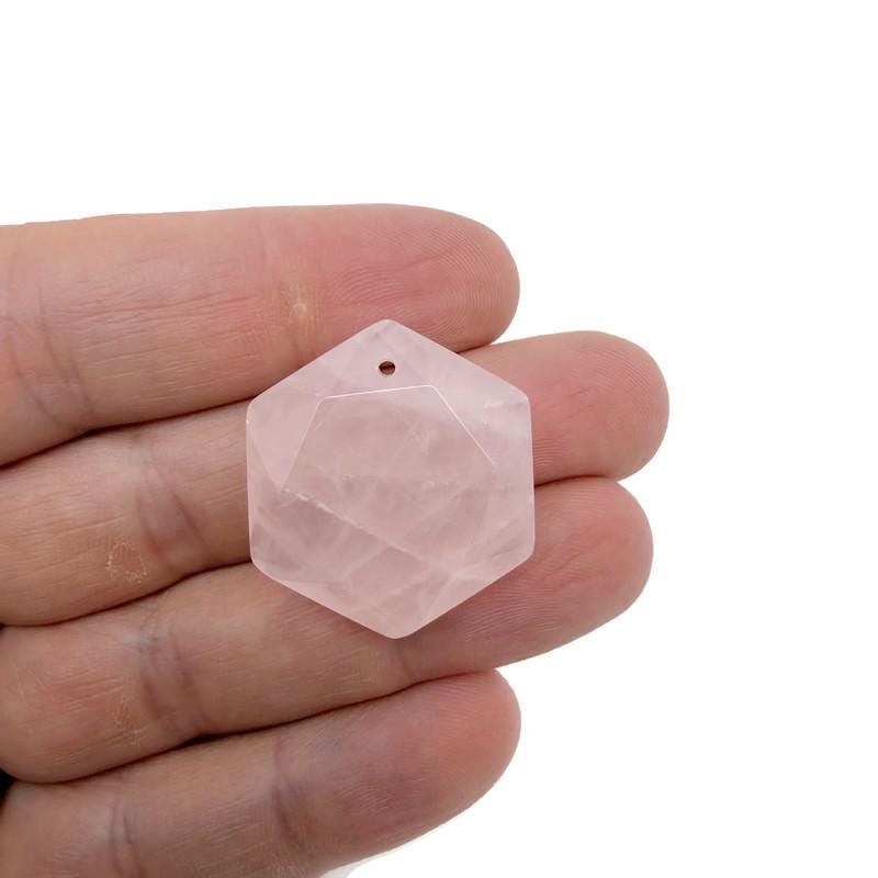 Faceted rose quartz hexagon crystal pendant on a necklace, showcasing a pink gemstone bead from GemstoneGO.