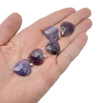 Faceted amethyst heart crystal pendant from GemstoneGO, showcasing a natural purple gemstone charm with detailed facets.