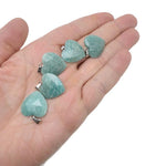 Faceted Amazonite heart-shaped crystal pendant by GemstoneGO featuring a natural gemstone charm on a silver chain.