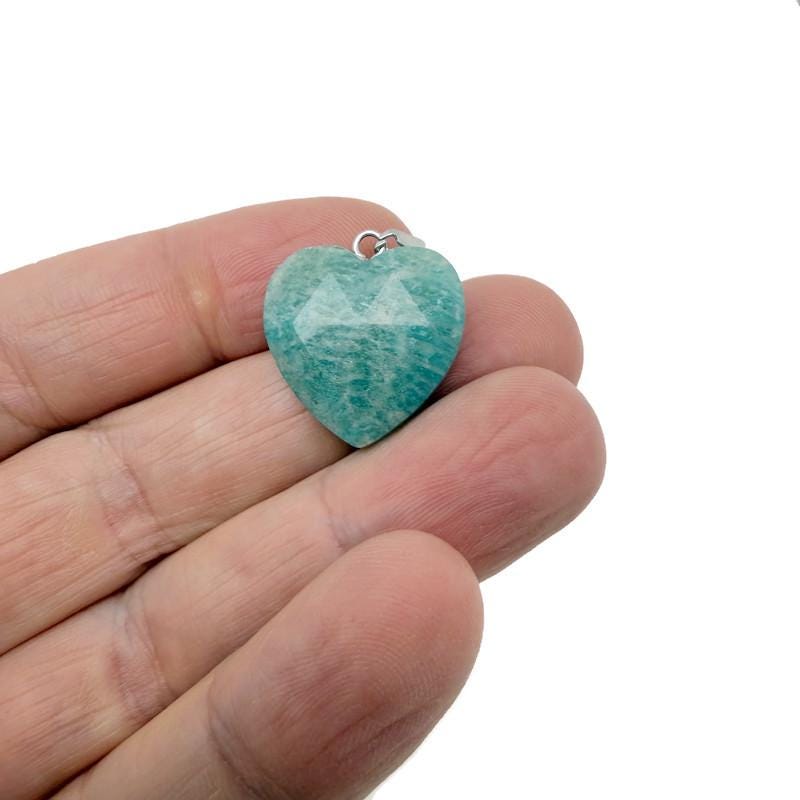 Faceted Amazonite heart crystal pendant from GemstoneGO featuring a natural, polished gemstone charm on a silver chain.
