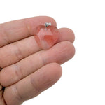 Faceted cherry quartz heart-shaped crystal pendant with natural gemstone charm, showcasing vibrant red color and detailed facets.