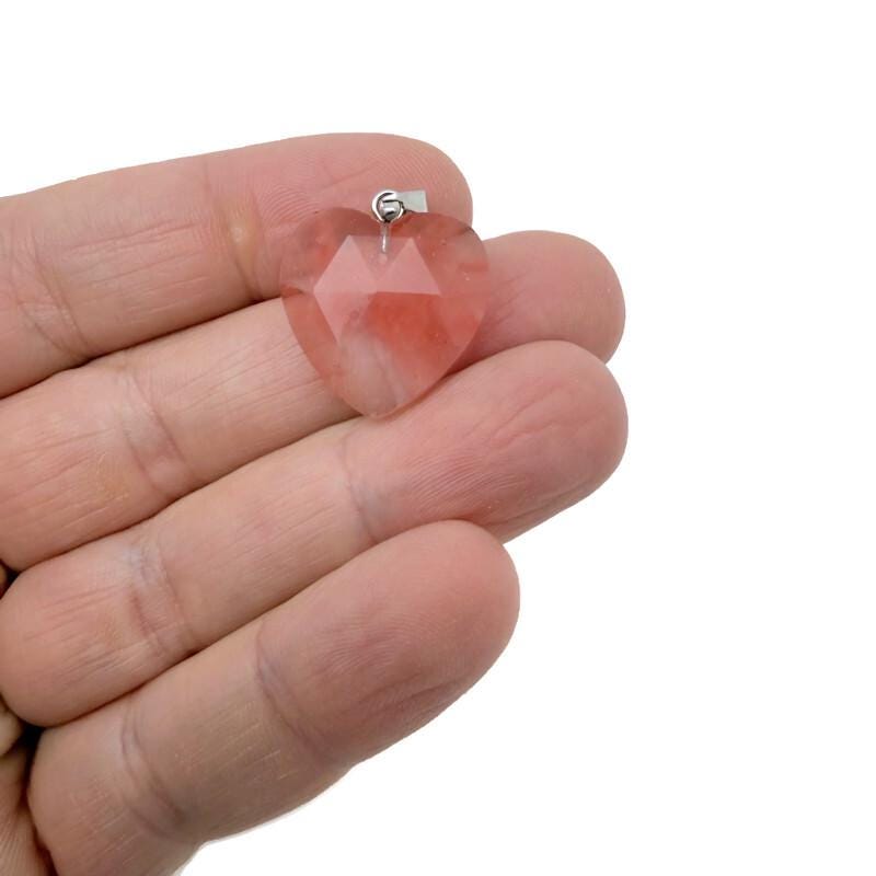 Faceted cherry quartz heart-shaped crystal pendant with natural gemstone charm, showcasing vibrant red color and detailed facets.