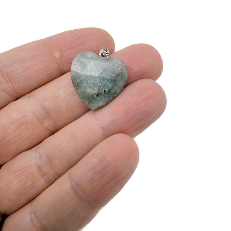 Labradorite faceted heart crystal pendant from GemstoneGO featuring a natural crystal charm with iridescent flashes.
