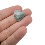Labradorite faceted heart crystal pendant from GemstoneGO featuring a natural crystal charm with iridescent flashes.
