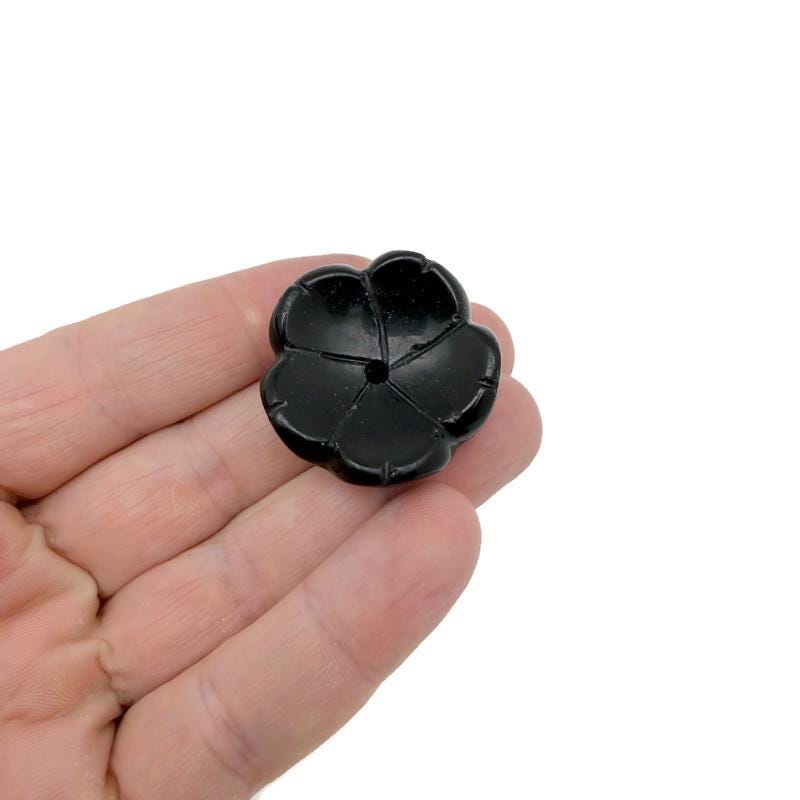 Obsidian crystal carving incense holder shaped like a flower, used for cleansing and relaxation, by GemstoneGO.
