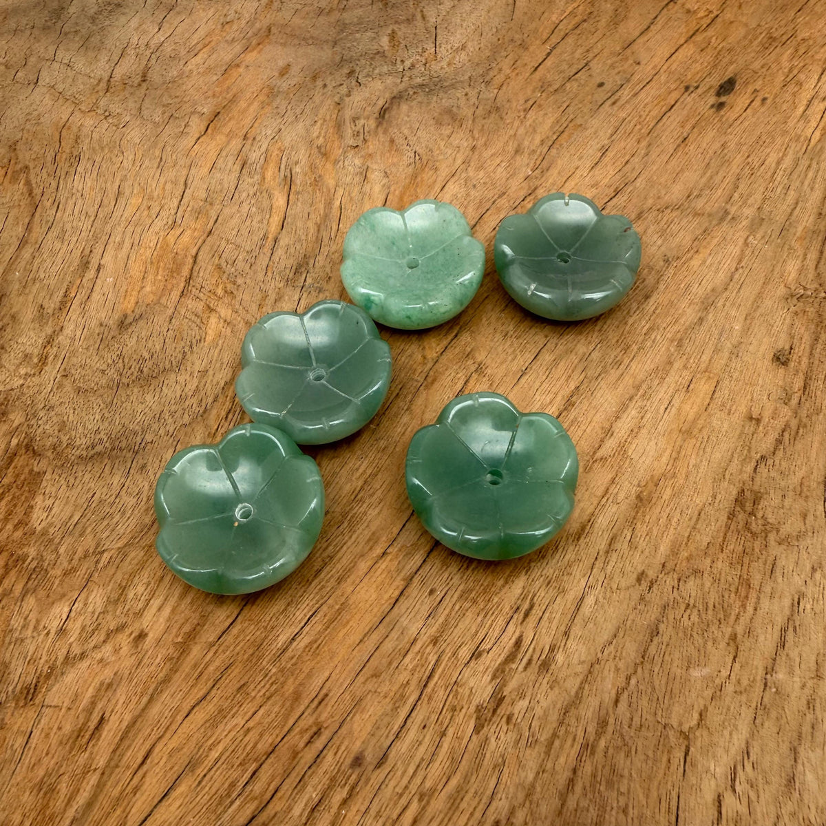 Aventurine crystal flower-shaped incense holder from GemstoneGO, designed for cleansing and relaxation, with carved floral details.