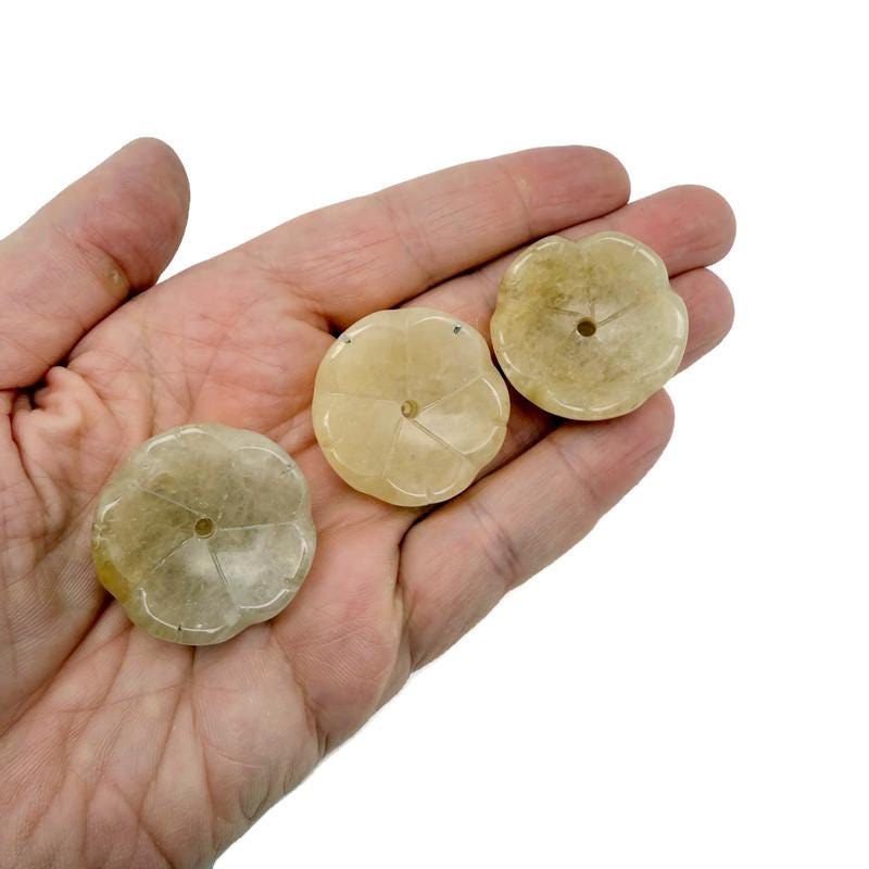 Yellow jade crystal flower-shaped incense holder from GemstoneGO, designed for cleansing and relaxation.