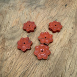 Red Jasper crystal flower incense holder with carved gemstone design, ideal for meditation and stick burning.