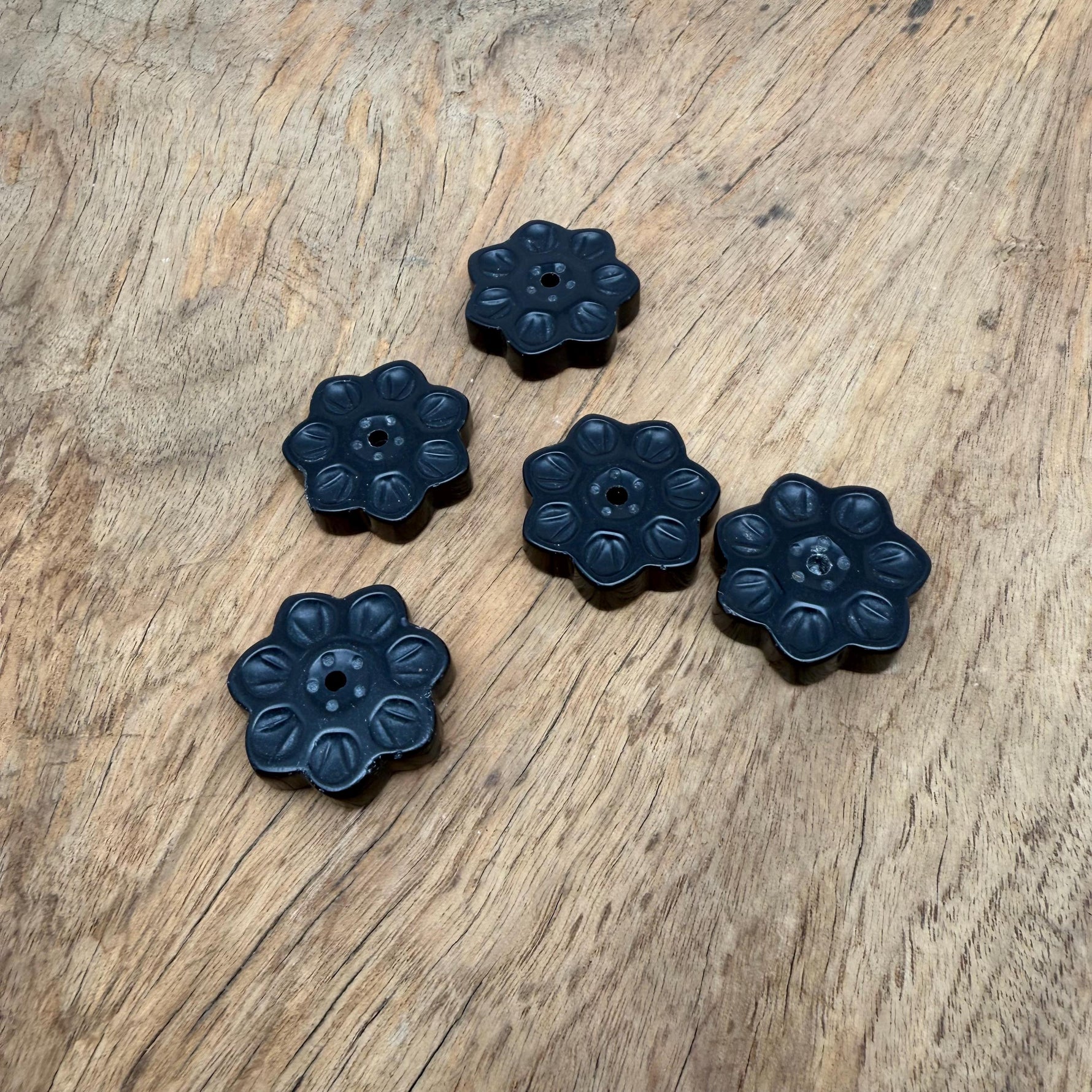 Obsidian natural crystal flower incense holder with carved gemstone design for meditation and stick burning.