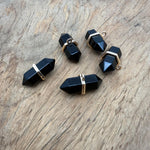 Natural obsidian double terminated crystal pendant from GemstoneGO, featuring a sleek gemstone point with polished surfaces.