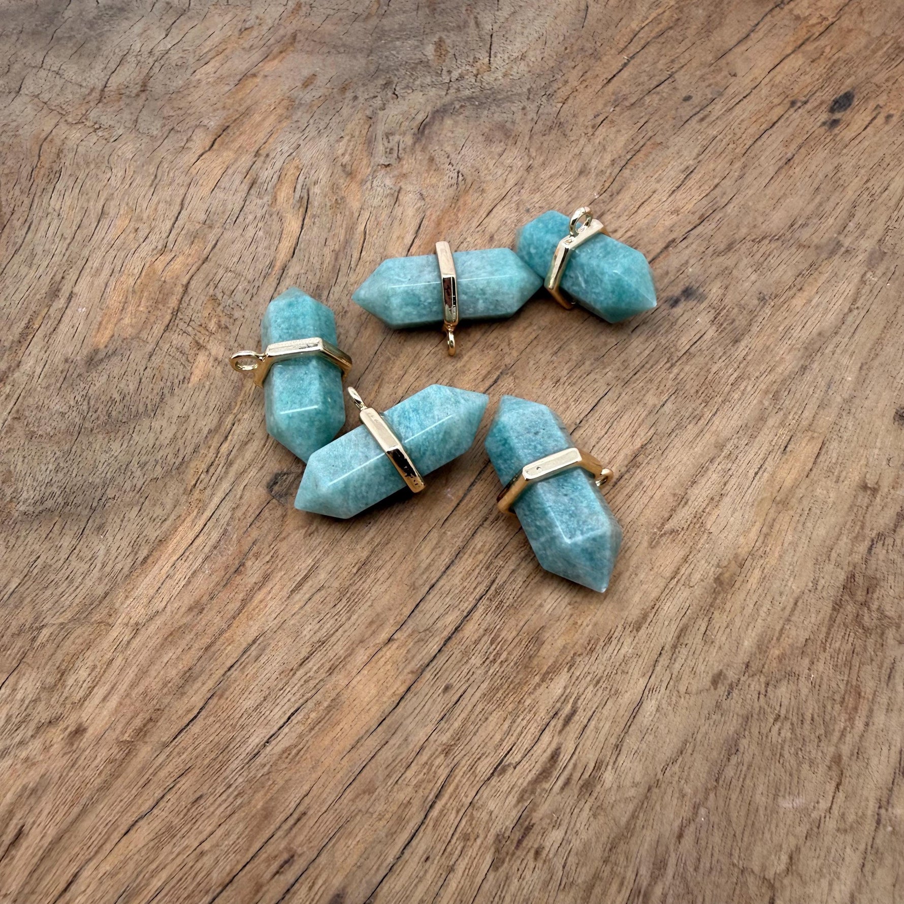 Amazonite double terminated crystal pendant by GemstoneGO, showcasing a natural gemstone point with vibrant blue-green hues.