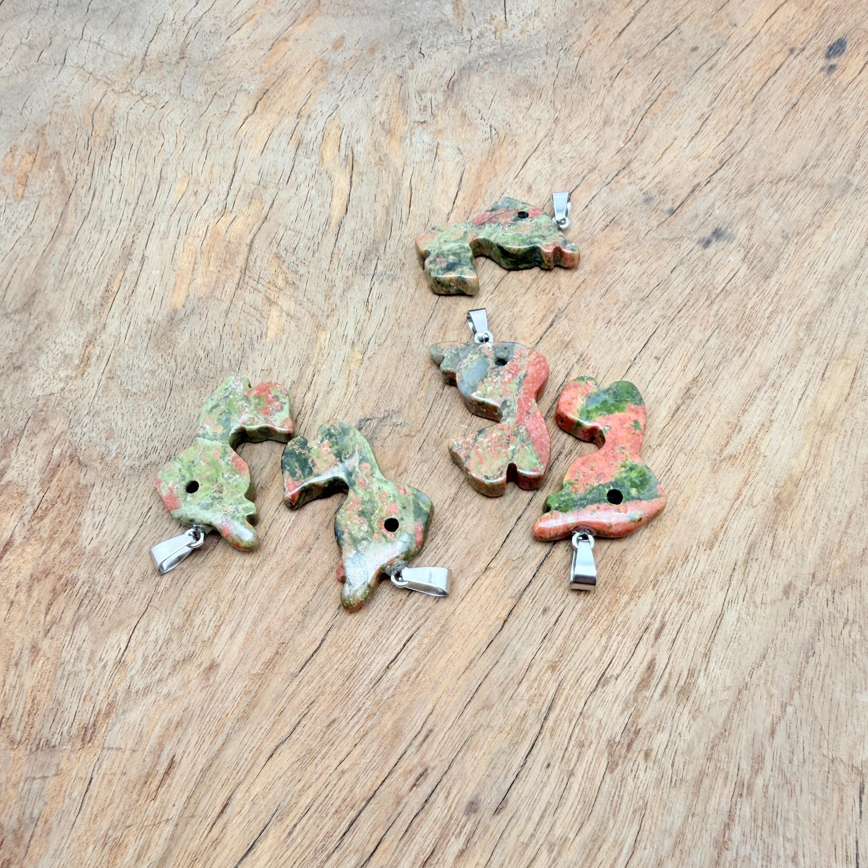 Unakite deer gemstone pendant necklace featuring a carved crystal deer charm on a chain, by GemstoneGO.