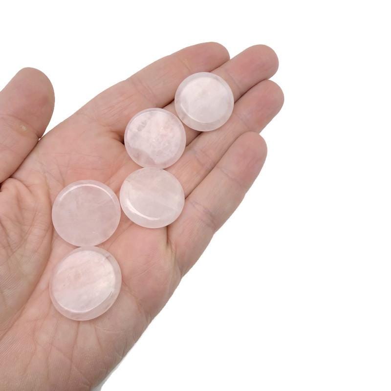 Round rose quartz gemstone slab, 25mm flat crystal, showcasing soft pink color and smooth polished surface.