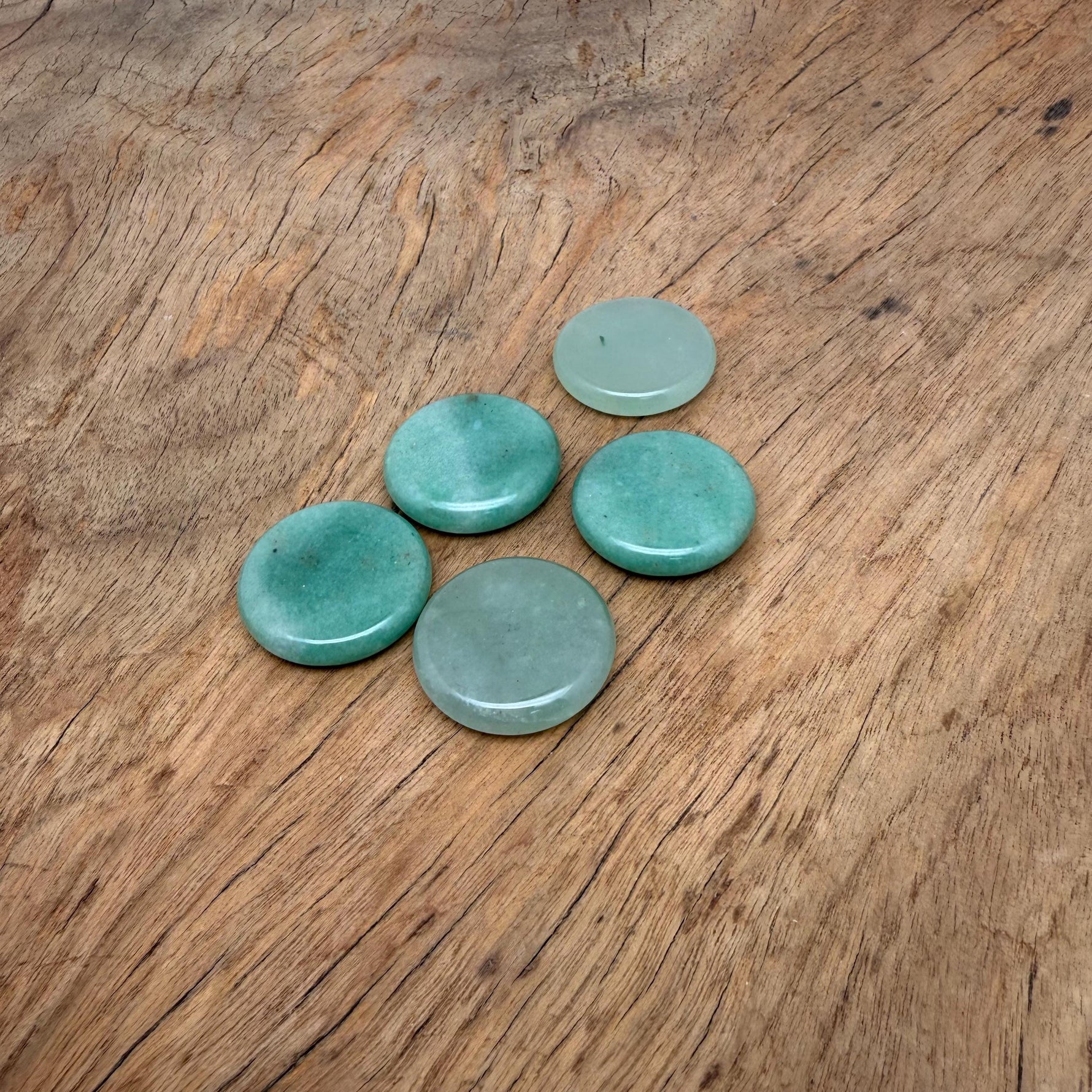 Round aventurine gemstone slab, 25mm flat crystal, vibrant green color, smooth surface, from GemstoneGO.