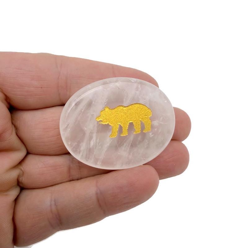 Animal engraved gold crystal totem stone featuring detailed gemstone engraving, showcasing a unique and decorative gemstone sculpture.