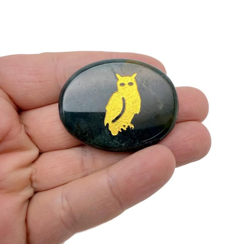 Gold crystal totem stones with engraved animal designs from GemstoneGO, showcasing polished, detailed gemstone animal carvings.