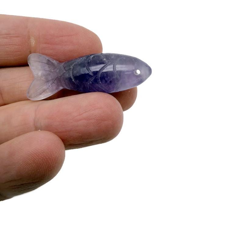 Handmade gemstone fish pendant with a lucky fishing charm, crafted by GemstoneGO, featuring colorful, polished gemstone details.