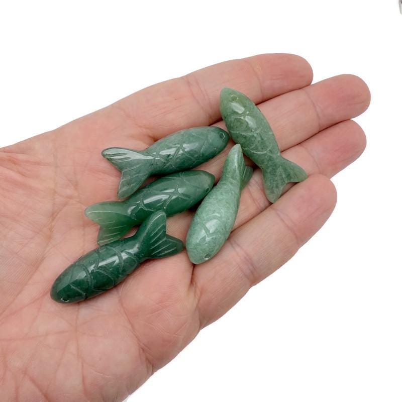 Aventurine fish gemstone pendant by GemstoneGO, featuring a lucky fishing charm design, polished and detailed for jewelry.