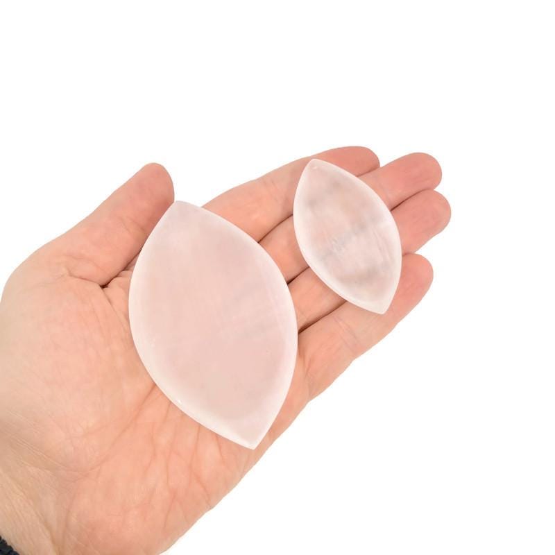 Polished Selenite leaf-shaped gemstone plate by GemstoneGO, carved crystal dish for home decor and display.
