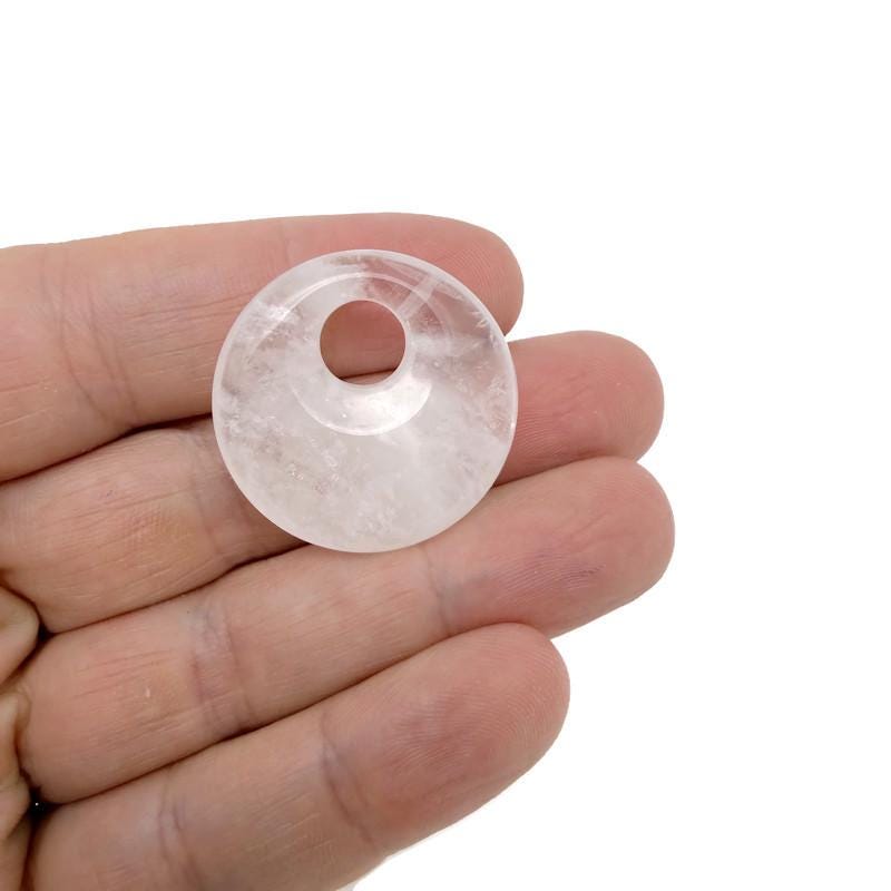 Polished crystal donut pendant from GemstoneGO, 30mm Pi Stone healing crystal component in mixed colors.