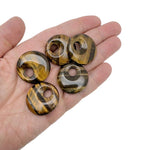 Tiger Eye crystal donut pendant, 30mm Pi Stone by GemstoneGO, showcasing the polished, golden-brown gemstone with distinctive chatoyancy.