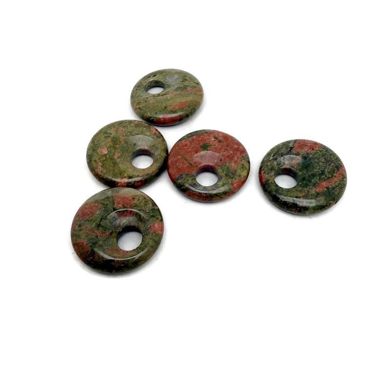 Unakite crystal donut pendant from GemstoneGO, 30mm Pi stone with vibrant green and pinkish-orange hues, polished and smooth.