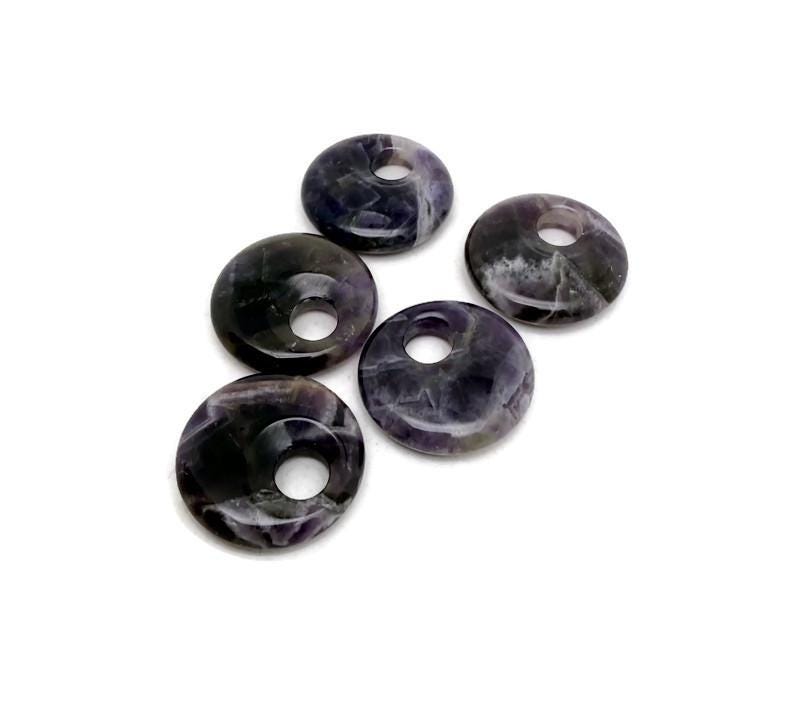 Amethyst crystal donut pendant from GemstoneGO, 30mm Pi stone with purple amethyst gemstone and smooth polished surface.