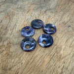 Amethyst crystal donut pendant, 30mm Pi stone from GemstoneGO, showing a polished purple gemstone with a hole in the center.