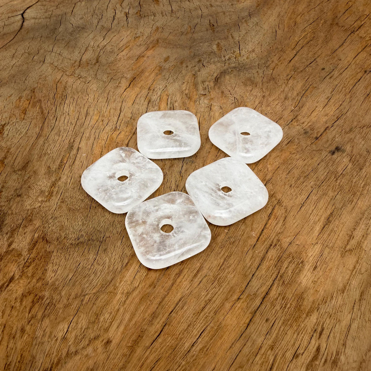 Clear quartz square crystal donut pendant from GemstoneGO, 30mm Pi stone with polished, translucent gemstone appearance.