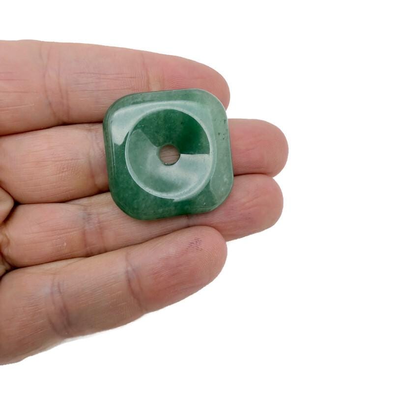 A 30mm Aventurine square crystal donut from GemstoneGO, featuring a polished green aventurine gemstone with a hole in the center.
