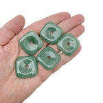 A 30mm aventurine square crystal donut gemstone from GemstoneGO, featuring a polished green aventurine stone with a smooth, shiny surface.