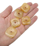 Yellow jade square crystal donut from GemstoneGO, 30mm Pi stone with vibrant yellow color and polished smooth surface.