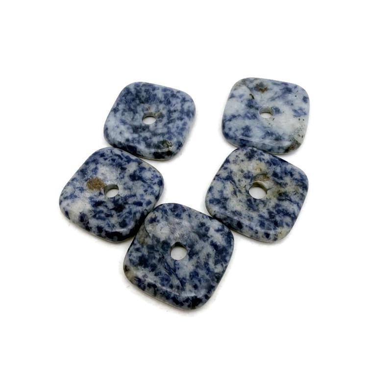 Sodalite square crystal donut pendant, 30mm Pi stone from GemstoneGO, featuring vibrant blue and white mineral patterns.