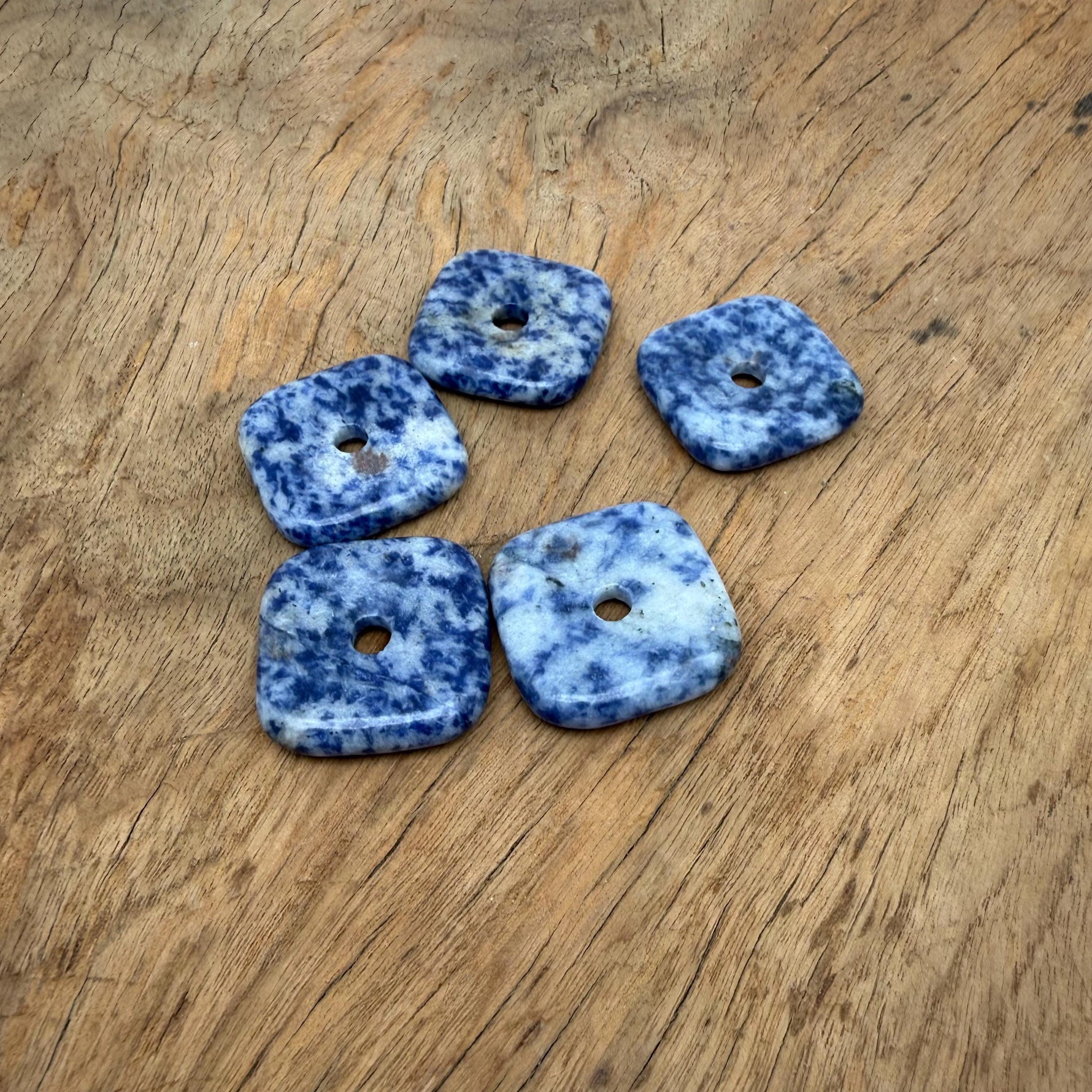 Sodalite square crystal donut pendant, 30mm Pi stone from GemstoneGO, featuring deep blue and white mineral patterns.