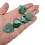 A 30mm Aventurine crystal heart with a hole, showcasing green gemstone with natural patterns and smooth polished surface.
