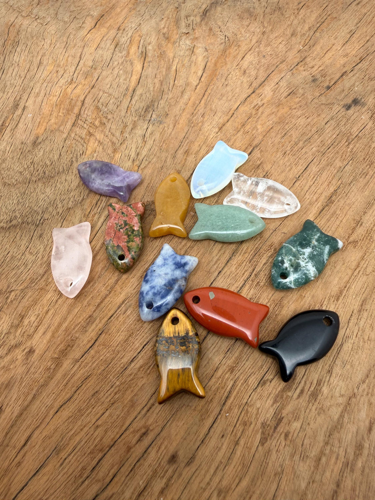 Fish-shaped crystal pendant from GemstoneGO featuring a healing stone design, perfect for jewelry and accessorizing.