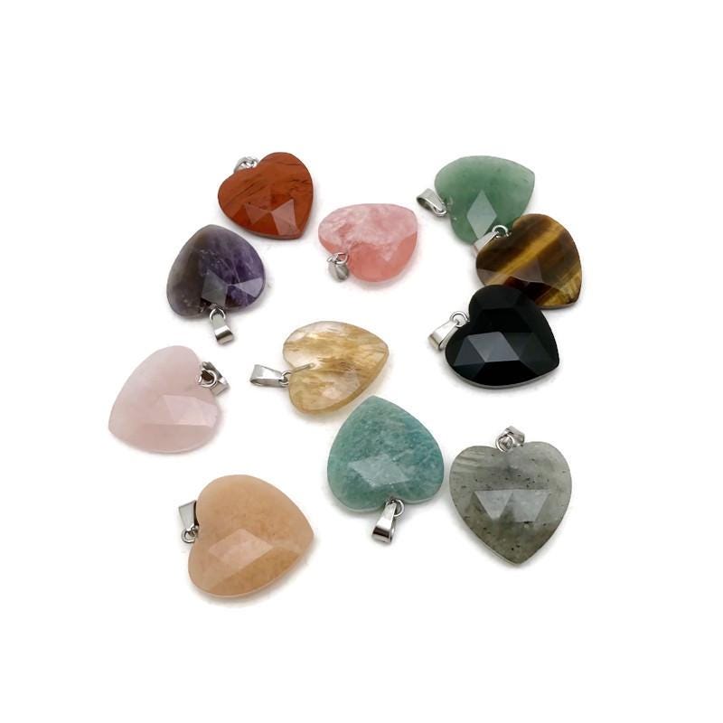 Faceted heart-shaped natural crystal pendant from GemstoneGO, showcasing a sparkling gemstone charm with intricate facets.