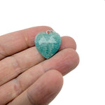 Faceted heart-shaped crystal pendant from GemstoneGO with natural crystal charm, showcasing a sparkling, clear gemstone on a delicate setting.