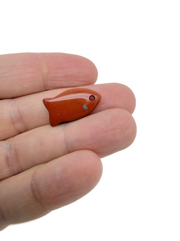 Red Jasper fish-shaped crystal pendant featuring a healing stone design, ideal for jewelry and spiritual accessories.