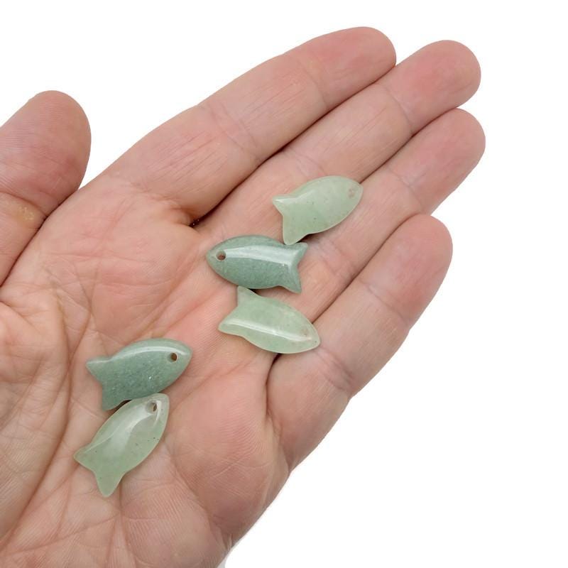 Aventurine fish-shaped crystal pendant with a polished green gemstone charm, designed for jewelry and healing energies.