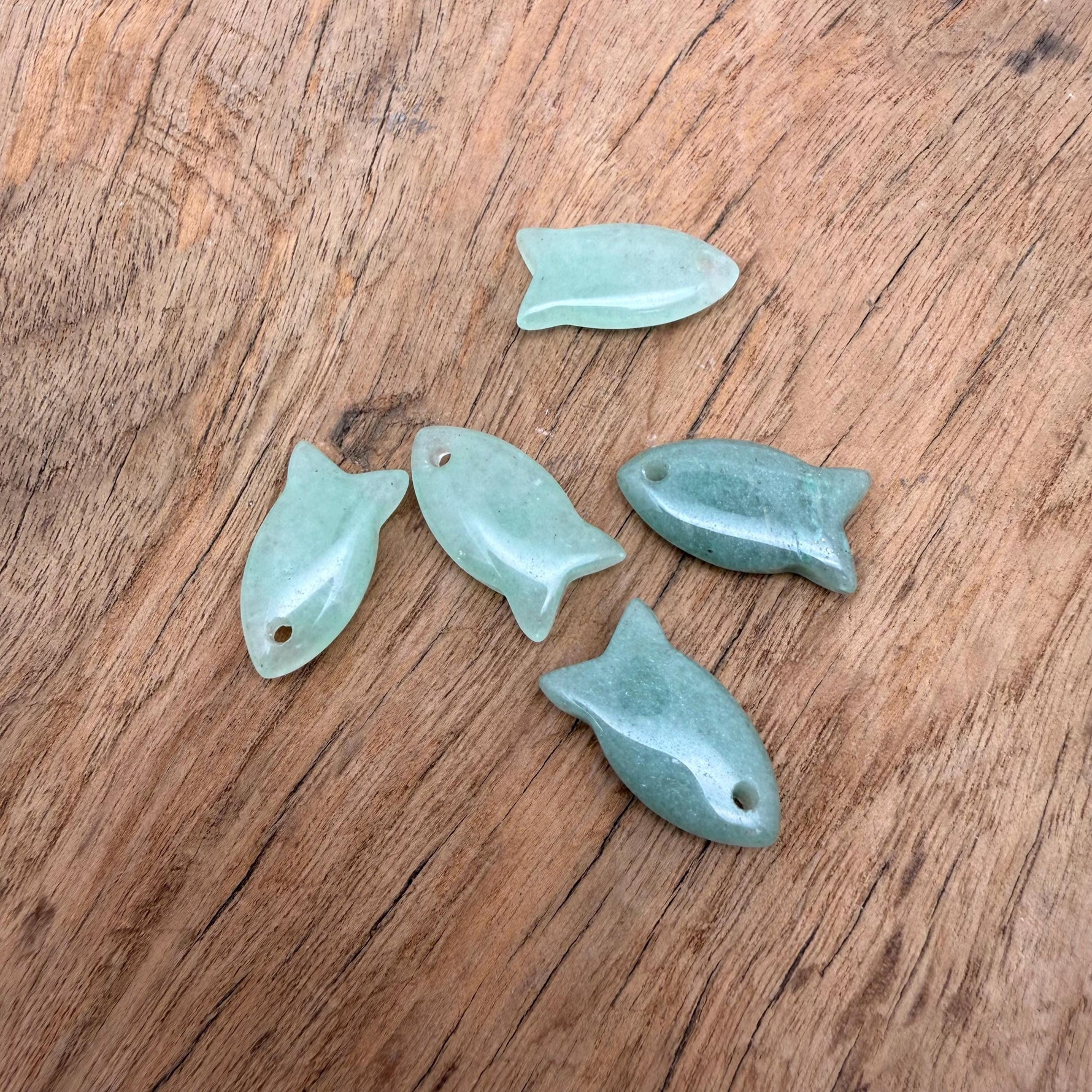 Aventurine fish-shaped crystal pendant with natural green gemstone, designed as a healing stone fish charm for jewelry.