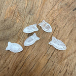 Clear quartz fish-shaped crystal pendant with a silver loop, designed for jewelry and healing stone purposes.