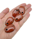 Red Jasper oval crystal pendant from GemstoneGO, natural stone jewelry bead with polished finish for jewelry making.