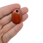 Red Jasper oval crystal pendant from GemstoneGO, showcasing a polished natural stone bead for jewelry making.