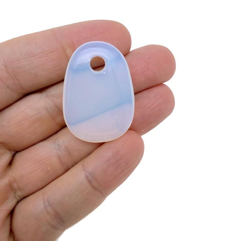 Opalite oval crystal pendant from GemstoneGO, showcasing a smooth, polished natural stone bead for jewelry making.