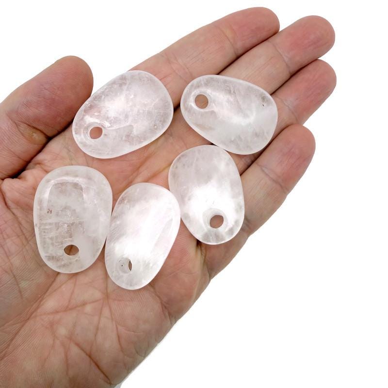 Clear quartz oval crystal pendant from GemstoneGO, natural stone jewelry making bead with polished smooth surface.