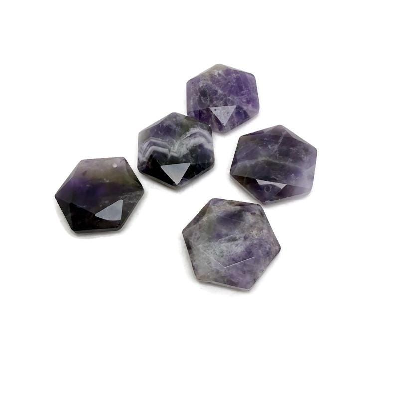 Faceted amethyst hexagon crystal pendant necklace with gemstone bead, featuring a natural purple gemstone on a silver chain.